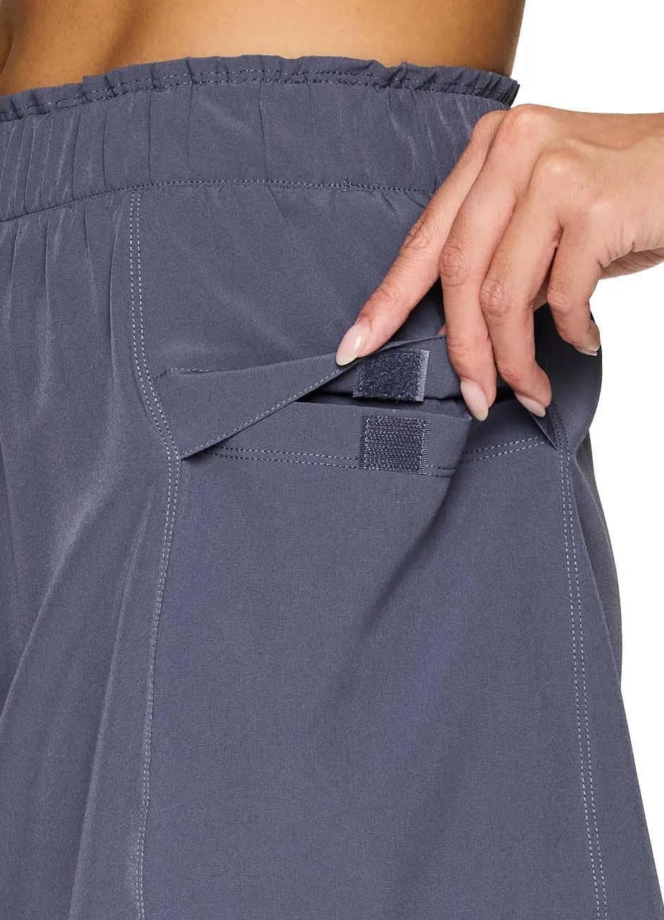 RBX Active Skort for Women, Longer Length Cargo-Style Quick Drying Hiking Tennis Skirt with Inner Compression Short